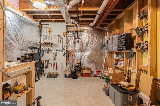 unfinished below grade area with a workshop area
