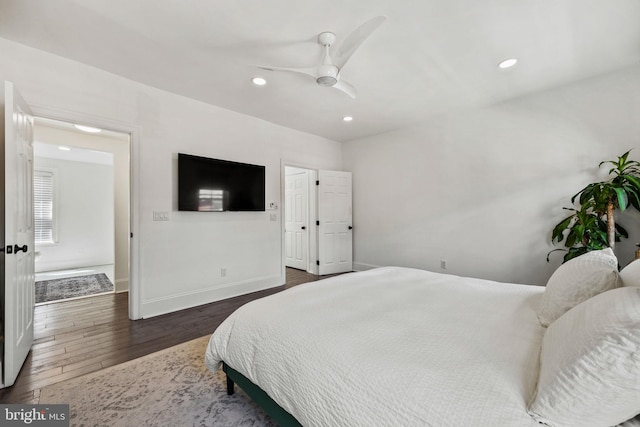 bedroom featuring recessed lighting, a ceiling fan, baseboards, and dark wood-type flooring