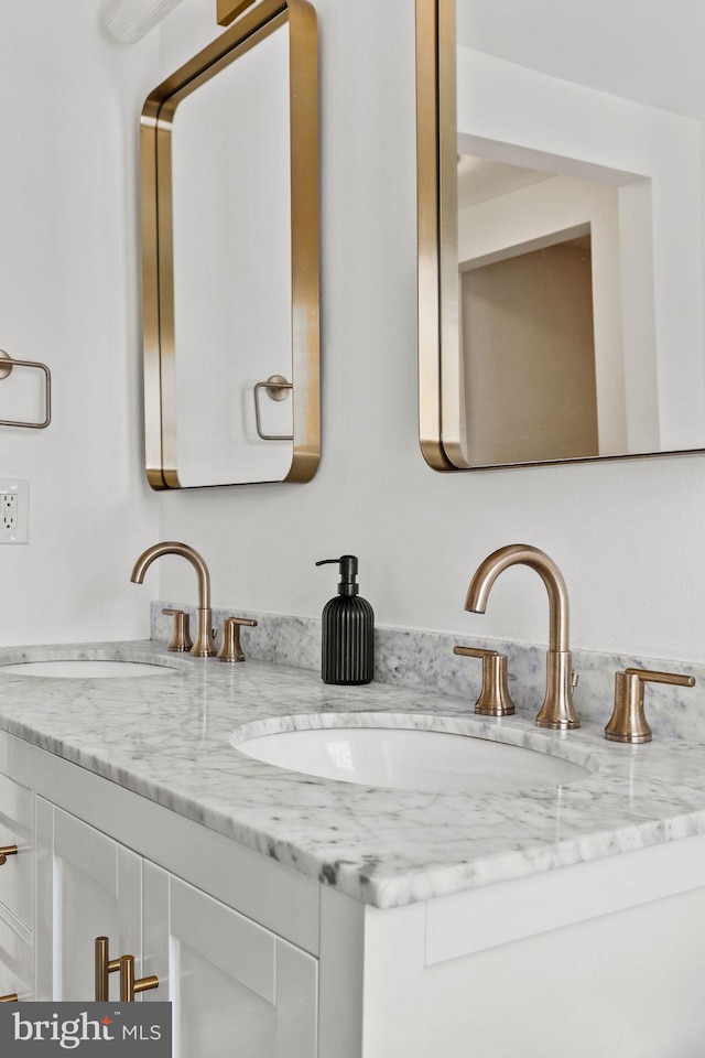 bathroom featuring double vanity and a sink