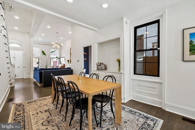 dining room with wood finished floors, visible vents, recessed lighting, and baseboards