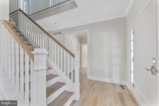 17 Hickory Ln, Malvern, PA 19355 - foyer with ornamental molding, visible vents, stairway, and wood finished floors