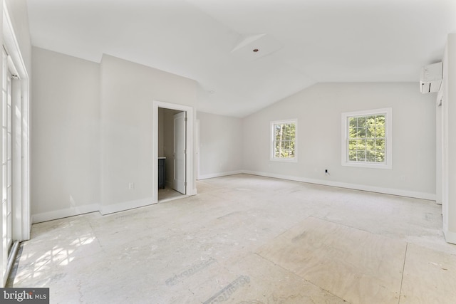 17 Hickory Ln, Malvern, PA 19355 - unfurnished bedroom featuring baseboards, a wall unit AC, and lofted ceiling