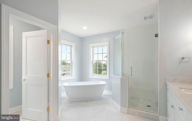 17 Hickory Ln, Malvern, PA 19355 - full bathroom featuring a stall shower, vanity, a soaking tub, baseboards, and visible vents