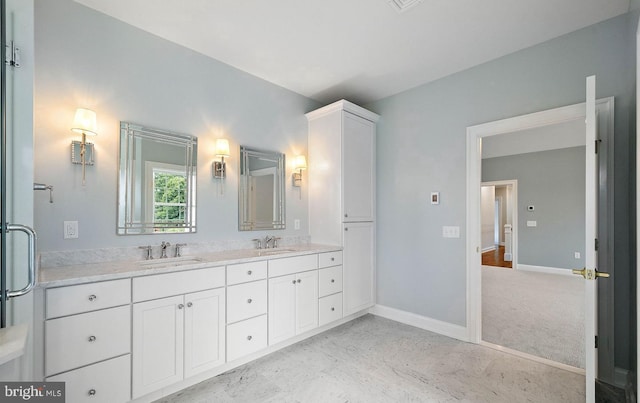 17 Hickory Ln, Malvern, PA 19355 - bathroom featuring double vanity, marble finish floor, baseboards, and a sink