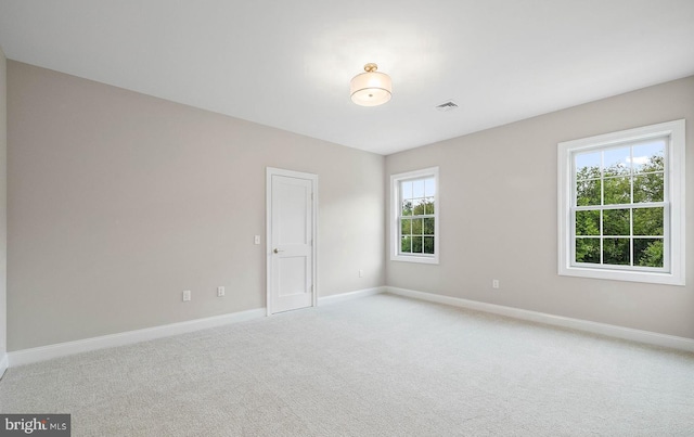 17 Hickory Ln, Malvern, PA 19355 - spare room featuring baseboards, visible vents, and light carpet