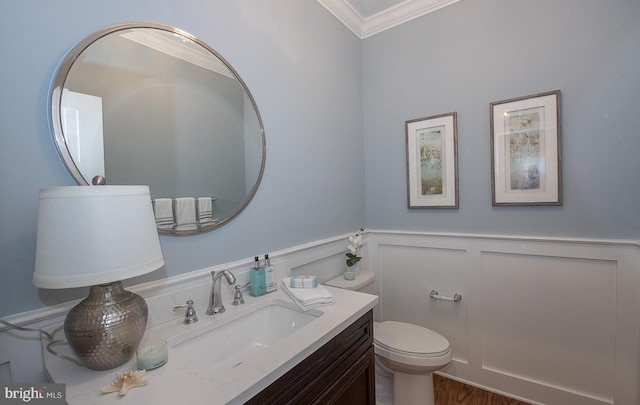 17 Hickory Ln, Malvern, PA 19355 - bathroom with a decorative wall, vanity, a wainscoted wall, toilet, and ornamental molding