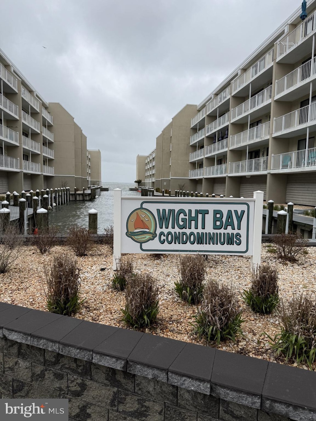 community / neighborhood sign featuring a water view