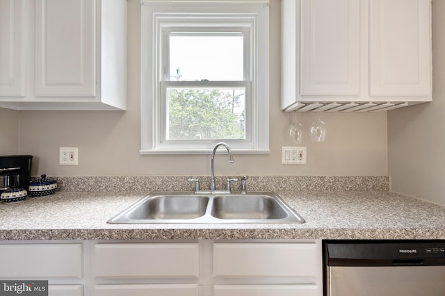 3809 13th St S, Arlington, VA 22204 - kitchen featuring stainless steel dishwasher, white cabinets, a sink, and light countertops