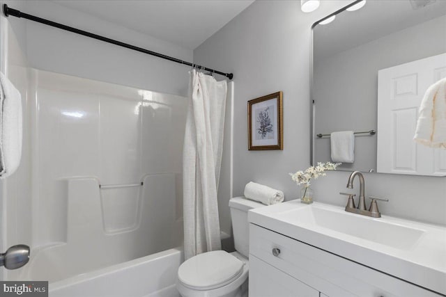 full bath with toilet, vanity, and shower / bath combination with curtain