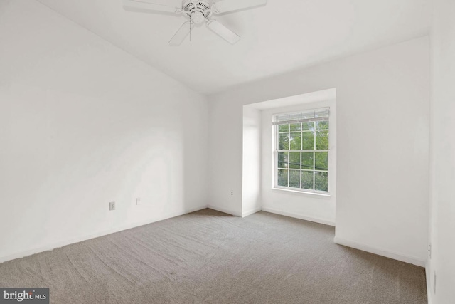 unfurnished room featuring carpet floors, a ceiling fan, and lofted ceiling