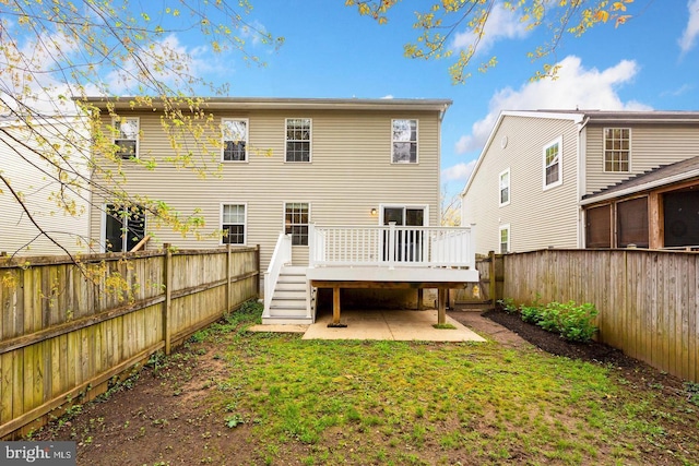 back of house with a fenced backyard, stairway, a patio area, and a deck