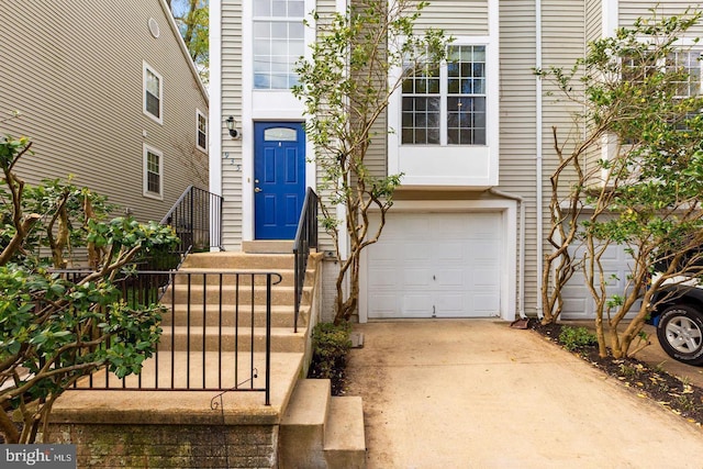 entrance to property with a garage and driveway