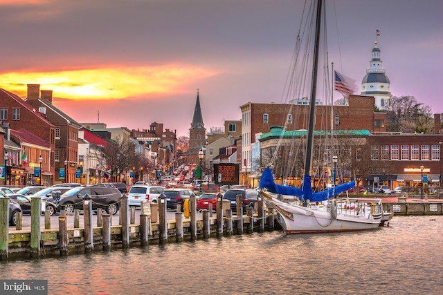 surrounding community with a water view