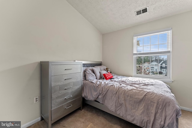 10633 Campus Way S, Upper Marlboro, MD 20774 - bedroom featuring vaulted ceiling, visible vents, baseboards, a textured ceiling, and light colored carpet