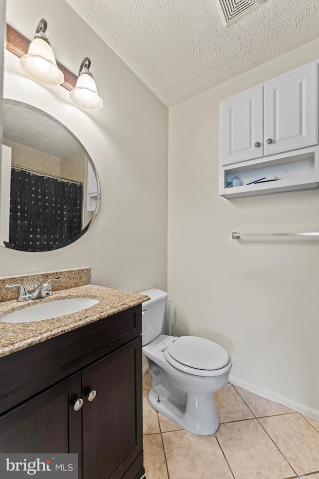 10633 Campus Way S, Upper Marlboro, MD 20774 - bathroom featuring tile patterned floors, a textured ceiling, toilet, visible vents, and vanity