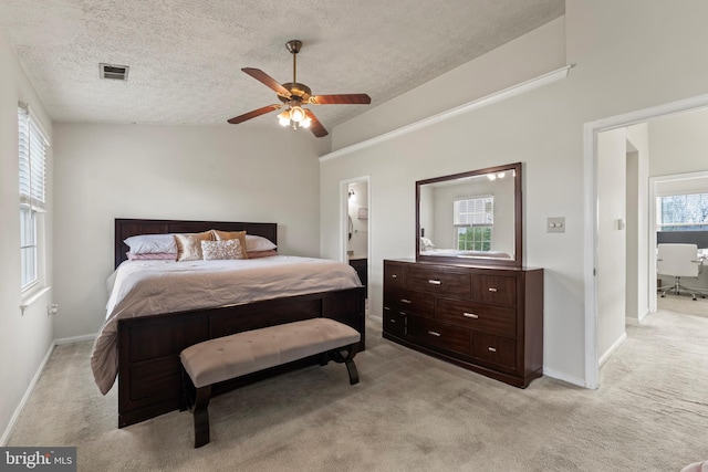 10633 Campus Way S, Upper Marlboro, MD 20774 - bedroom with light carpet, a textured ceiling, ensuite bathroom, baseboards, and visible vents