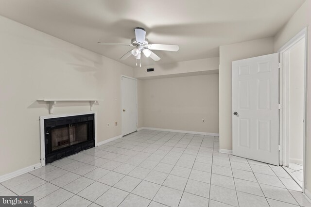 10633 Campus Way S, Upper Marlboro, MD 20774 - unfurnished living room featuring light tile patterned flooring, baseboards, visible vents, ceiling fan, and a fireplace