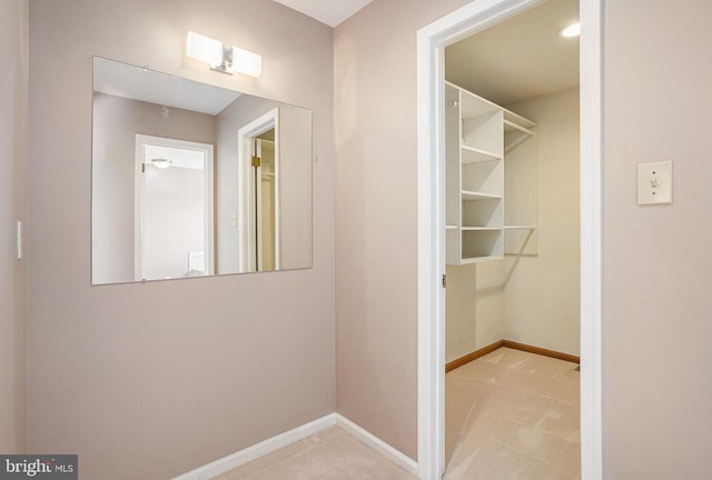 spacious closet with carpet flooring