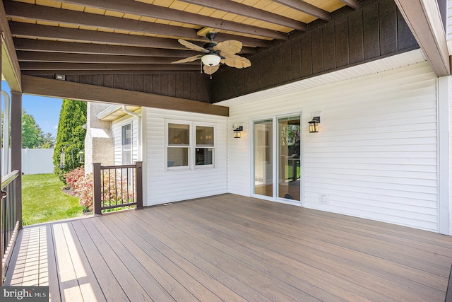 deck with ceiling fan and fence