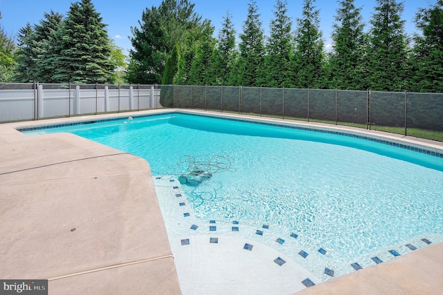 view of pool featuring fence