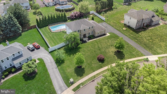 aerial view of residential area with a pool area
