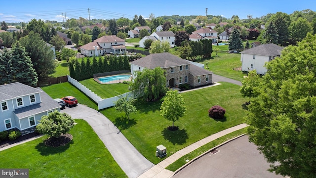 aerial view of residential area featuring a pool area