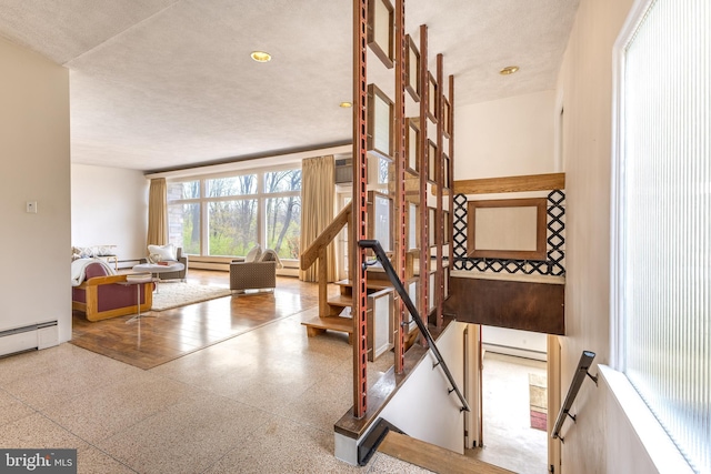 stairway with baseboard heating