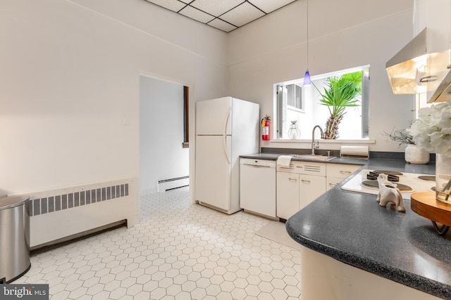 kitchen featuring white appliances, exhaust hood, a baseboard radiator, radiator heating unit, and dark countertops
