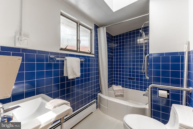 bathroom featuring tile patterned floors, shower / bathtub combination with curtain, toilet, and tile walls