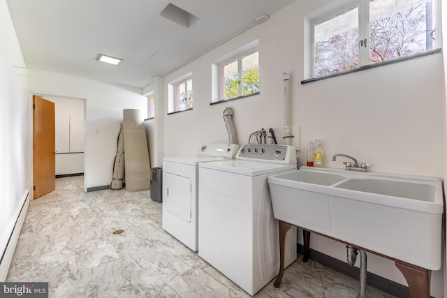 laundry area featuring separate washer and dryer, a sink, marble finish floor, and a baseboard radiator