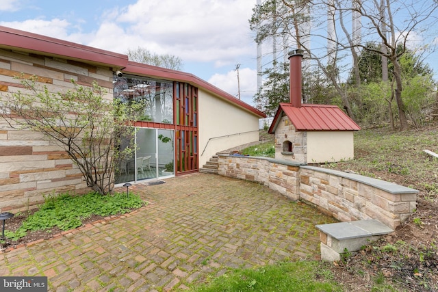view of yard with an outdoor structure and a patio area