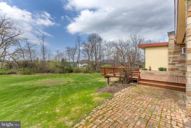 view of yard featuring a wooden deck
