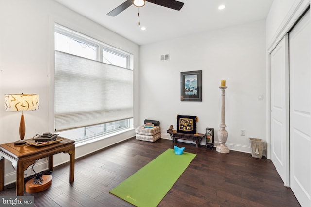 exercise area featuring recessed lighting, wood finished floors, visible vents, a ceiling fan, and baseboards