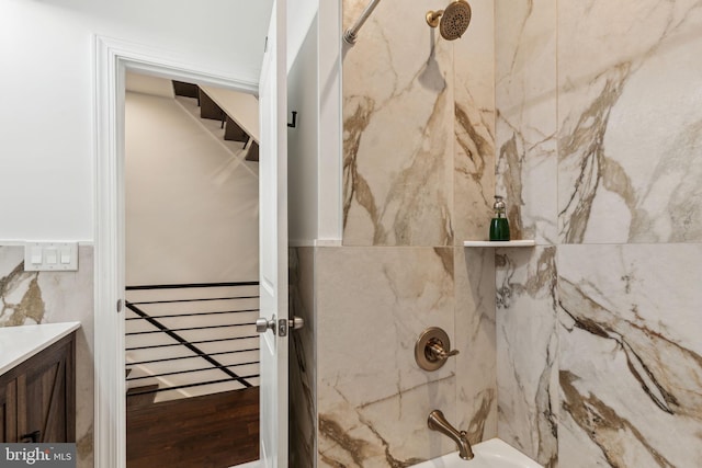 bathroom with vanity and  shower combination