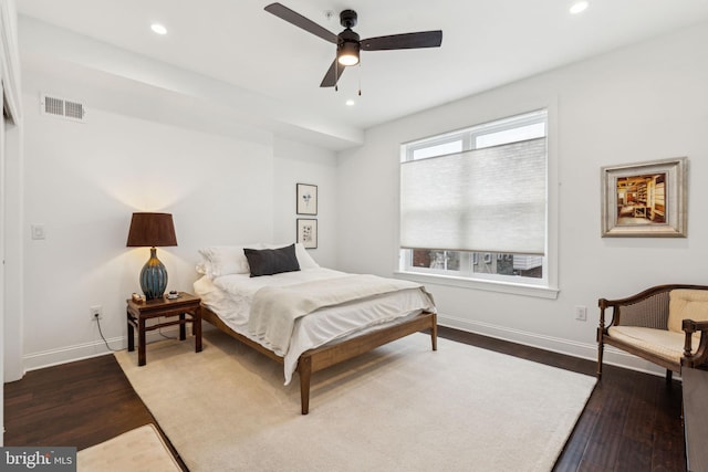 bedroom featuring recessed lighting, wood finished floors, visible vents, and baseboards
