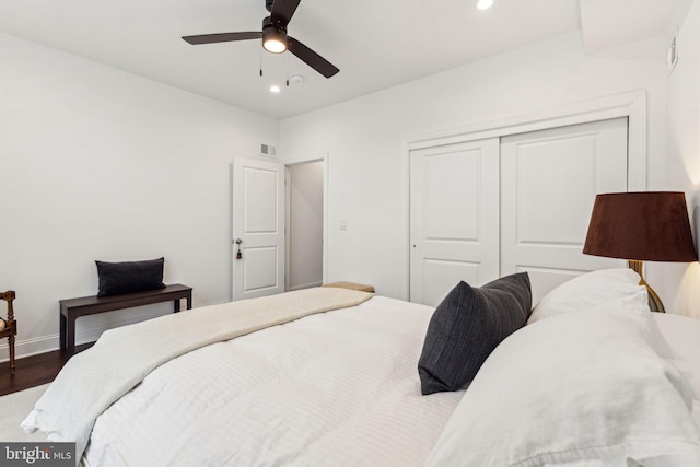 bedroom featuring recessed lighting, wood finished floors, a closet, and visible vents