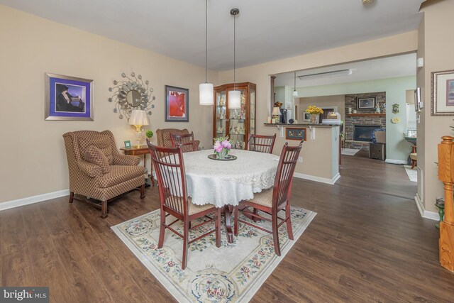 420 Concetta Dr, Mount Royal, NJ 08061 - dining area with dark wood-style flooring, baseboards, and a fireplace