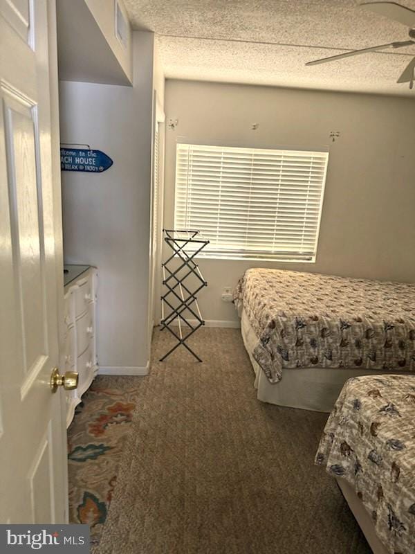 504 E 17th Ave Unit 206, Wildwood, NJ 08260 - carpeted bedroom with a textured ceiling, baseboards, and a ceiling fan