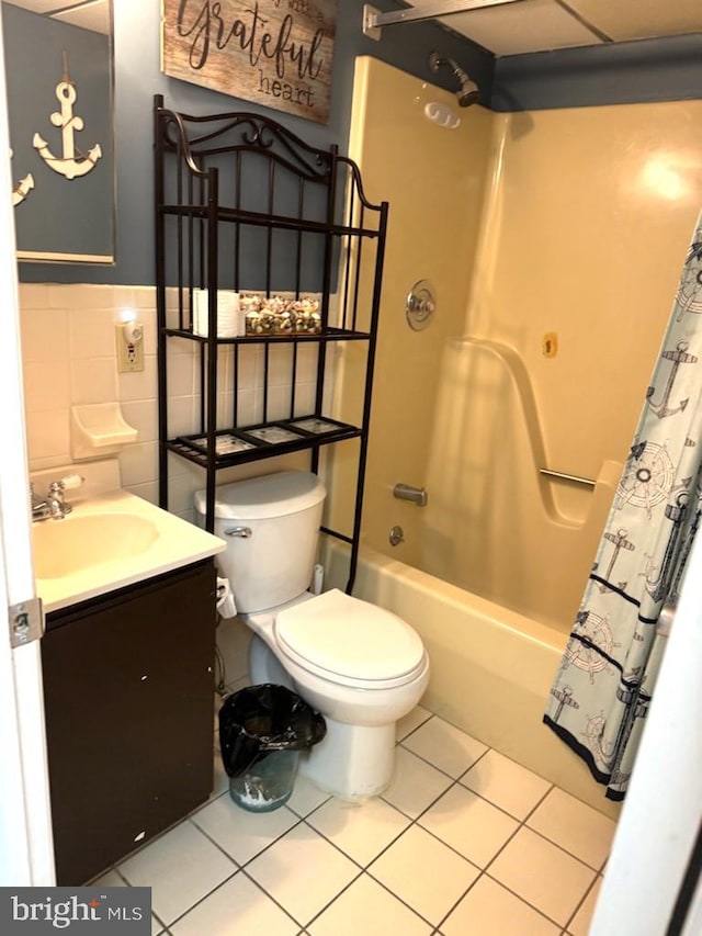 504 E 17th Ave Unit 206, Wildwood, NJ 08260 - bathroom with vanity, toilet, wainscoting, shower / tub combo with curtain, and tile patterned floors