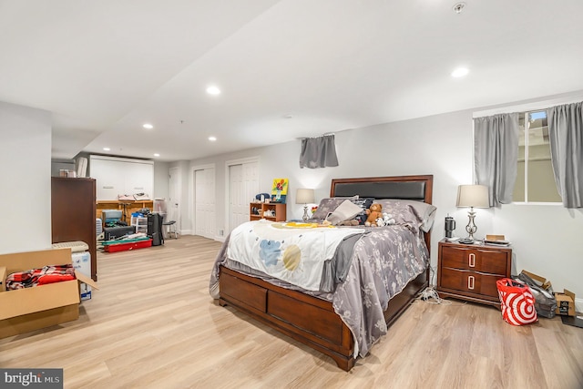 33 Brownstone Dr, East Norriton, PA 19401 - bedroom featuring two closets, baseboards, wood finished floors, and recessed lighting