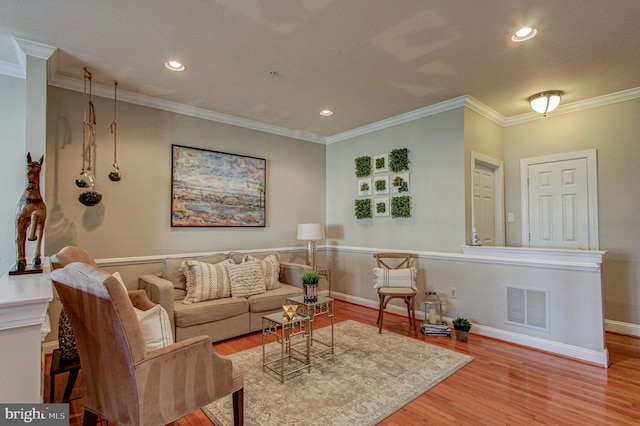 33 Brownstone Dr, East Norriton, PA 19401 - living room featuring crown molding, wood finished floors, visible vents, and recessed lighting