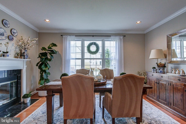 33 Brownstone Dr, East Norriton, PA 19401 - dining room featuring a premium fireplace, ornamental molding, and light wood-style flooring