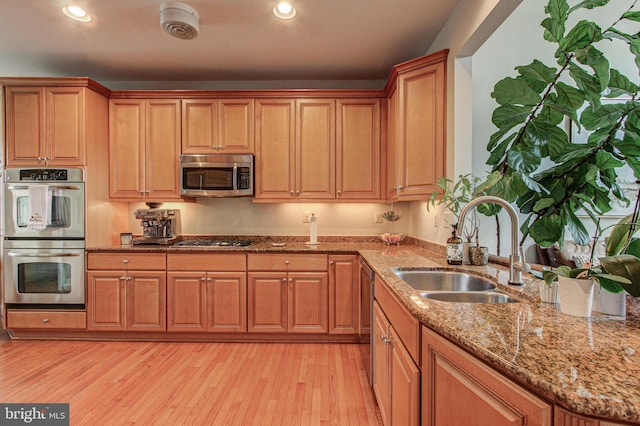 33 Brownstone Dr, East Norriton, PA 19401 - kitchen featuring light wood finished floors, stainless steel appliances, a sink, and recessed lighting