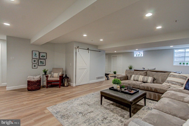 33 Brownstone Dr, East Norriton, PA 19401 - living area with light wood-style flooring, a barn door, baseboards, visible vents, and recessed lighting