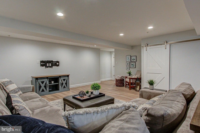 33 Brownstone Dr, East Norriton, PA 19401 - living area featuring a barn door, baseboards, light wood finished floors, and recessed lighting