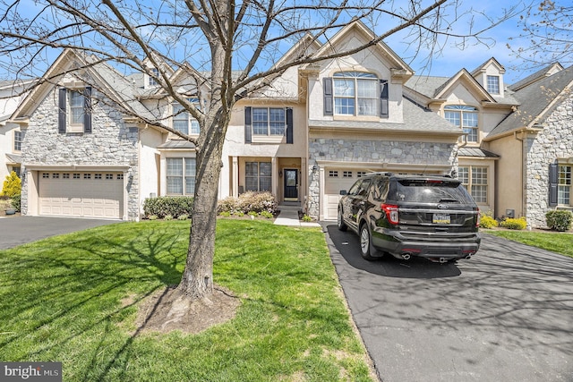 33 Brownstone Dr, East Norriton, PA 19401 - view of front facade with driveway and stone siding