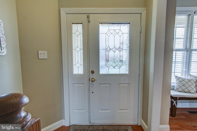 33 Brownstone Dr, East Norriton, PA 19401 - foyer entrance featuring wood finished floors, visible vents, baseboards, and plenty of natural light