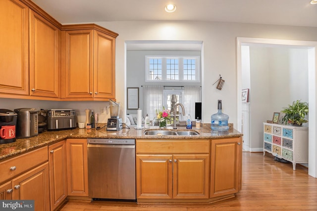33 Brownstone Dr, East Norriton, PA 19401 - kitchen featuring stainless steel dishwasher, a sink, brown cabinetry, light wood-type flooring, and recessed lighting