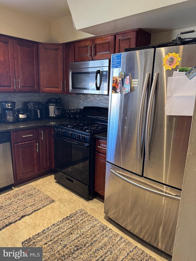 3525 Nottingham Ln, Philadelphia, PA 19114 - kitchen with tasteful backsplash, dark countertops, dark brown cabinets, and appliances with stainless steel finishes