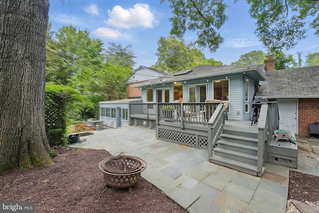 3312 Sleepy Ln, Falls Church, VA 22044 - back of property with an outdoor fire pit, a patio area, a deck, and a chimney